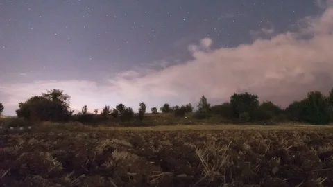 Stars, clouds moving at night timelapse on farm with slider Stock Footage 119899278