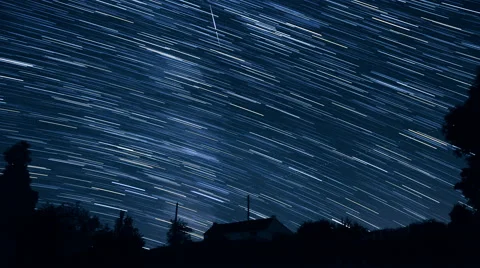 Stars create trails in the sky and seem falling - Starry night in timelapse Stock Footage 68334300
