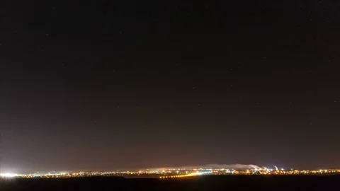 The stars in the night sky move around the polar star in the background lit.. Stock Footage 71209072