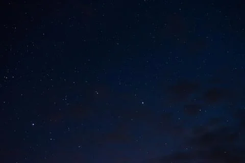 Stars in the night sky through the clouds Stock Photos