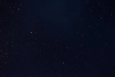 Stars in the night sky through the clouds Stock Photos