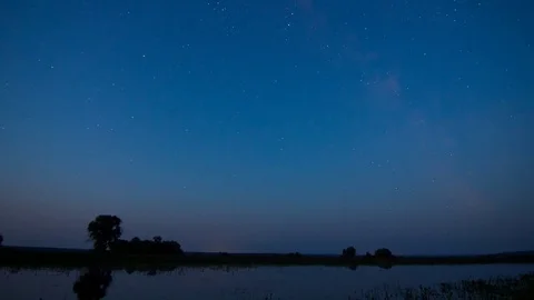 Stars Sky Turning Space with reflection in lake Time Lapse Vídeo Stock 72154501