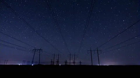 Stars Time Lapse. Electricity pylons at night. Power lines Stock Footage