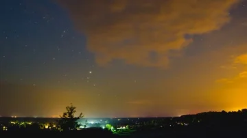 Stars Time Lapse over the city lights Stock Footage