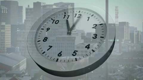On start analog clock hands sweeping from 1 to 1 15 over cityscape showing time Видео 319783714