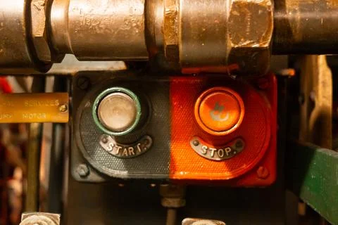 Start and stop buttons inside an old military submarine control panel Stock Photos