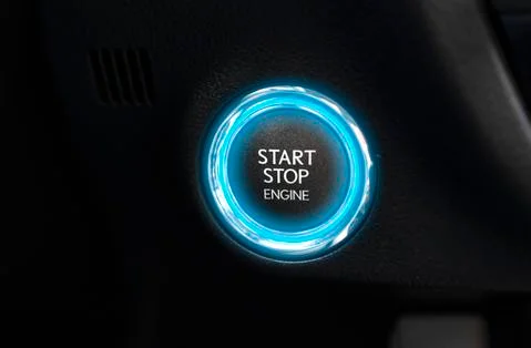 Start and stop engine button in a modern car Stock Photos