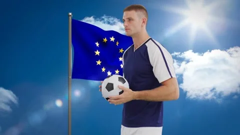 Start, athlete adjusting grip on soccer ball beside EU flag, shifting torso, Stock Footage 334768392