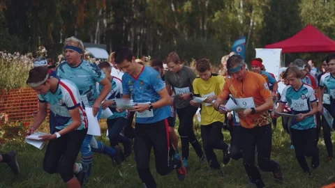 Start of athletes for orienteering Stock Footage 214079083