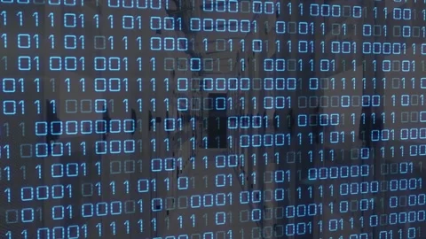 On start blue binary overlay flickering shifting digits, revealing office Stock Footage 317593160