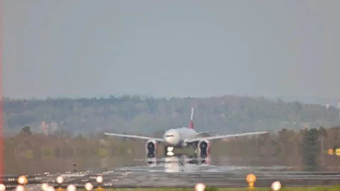 Start of an boeing 777 operaterd by austrian airlines Stock Footage 128354730