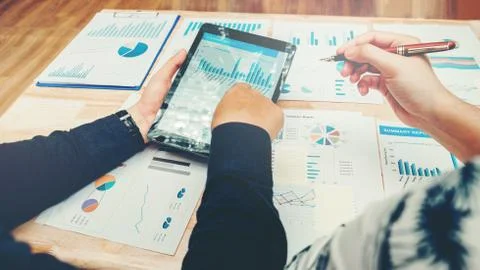 Start up business team meeting working on digital tablet new business project Stock Photos