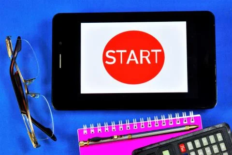 Start button on your tablet computer.Start-the beginning of the competition Stock Photos