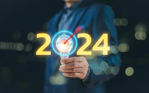 Start calendar 2024 plan concept. Businessman show light blub with action tar Stock Photos