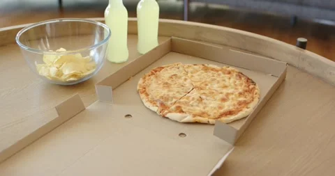 At start camera is moving closer over round wooden table, showing cheese pizza, Stock Footage 341851787