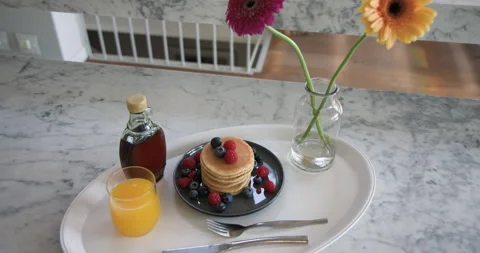 At start camera is panning and zooming in on pancake stack to highlight fresh 스톡 동영상 310358897