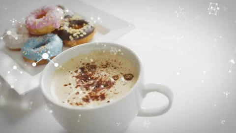 On start camera shifting, coffee cup dominating front, glowing nodes drifting Stock Footage 323269555