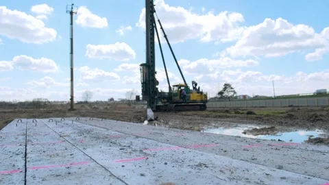 Start of construction, driving the first pile . Stock Footage 241578747