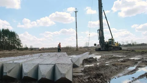 Start of construction, driving the first pile . Stock Footage 241578750