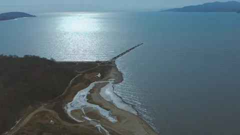 Start of construction of a low-water bridge at sea Stock Footage 104346832