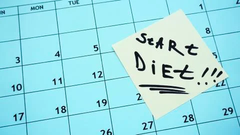 Start of the diet. start date of the diet and a calendar with a list. Stock Photos