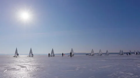 Start of a DN Ice boat race on a frozen lake Stock Footage 158910028