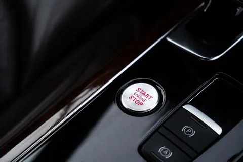 Start engine stop button Interior of modern luxury car. Details of automatic Stock Photos