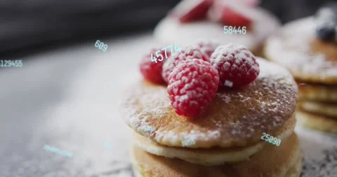 On start falling sugar dusting pancakes as floating numbers creating data-driven Stock Footage 320506773