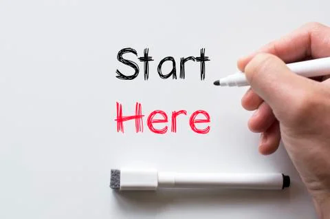 Start here written on whiteboard Stock Photos