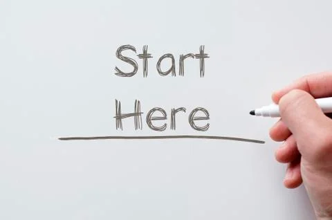 Start here written on whiteboard Stock Photos