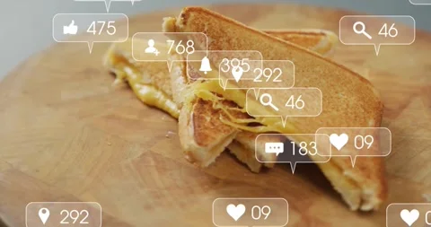 At start icons popping and floating over grilled cheese sandwich illustrating Stock Footage 325774780