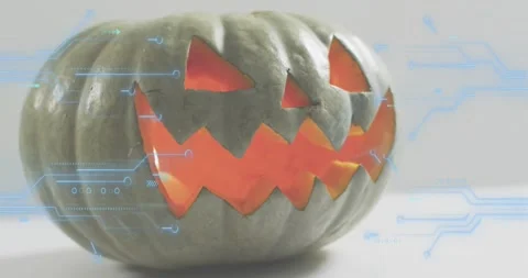 On start jack-o'-lantern glowing getting blue circuits fading pulsing around Video stock 317834587