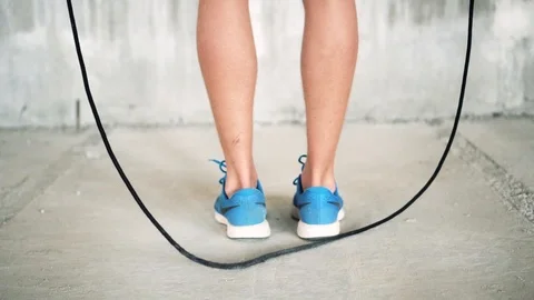 Start of a jump rope routine of a young man training for competition Stock Footage 112653875