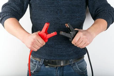 Start jumper cable in the hands. Stock Photos