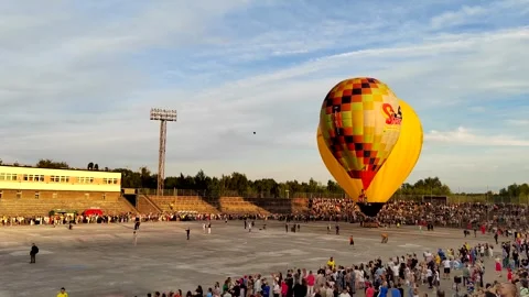 Start of the last two balloons from the stadium Stock Footage 248294283