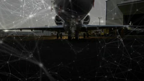 On start, low camera revealing jet nose through network overlay, crew performing Stock Footage 321782806