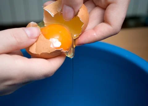 Start making pancakes, first breaking eggs Stock Photos