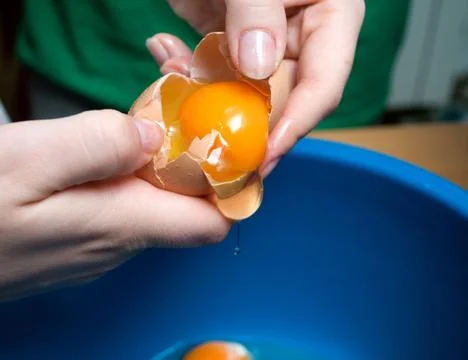 Start making pancakes, first breaking eggs Stock Photos