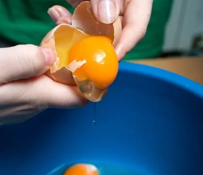 Start making pancakes, first breaking eggs Stock Photos