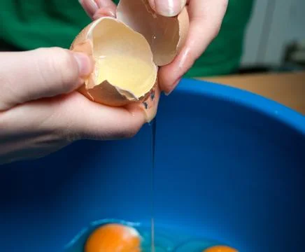Start making pancakes, first breaking eggs Stock Photos