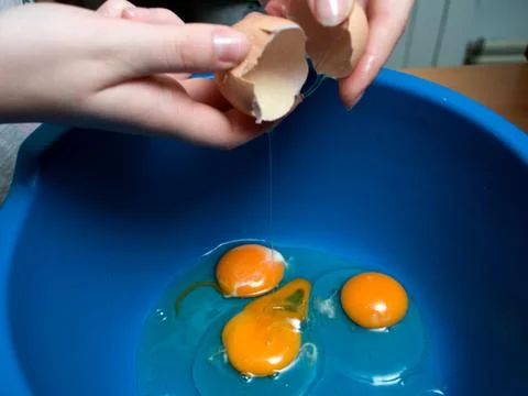 Start making pancakes, first breaking eggs Stock Photos
