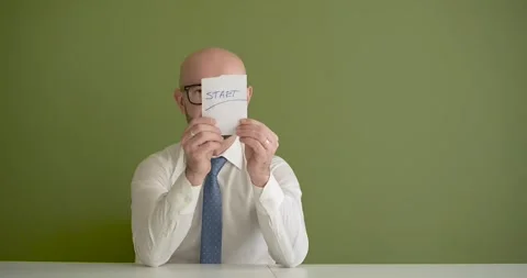 START - A man presents a note with the word Stock Footage 267087114