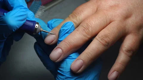 Start of manicure. manicure with the help of a nail polish machine. Stock Footage 90449299