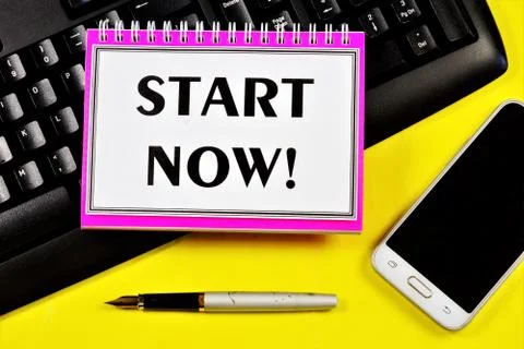 Start now - the text label on the notebook. Planning a strategy for achieving Stock Photos