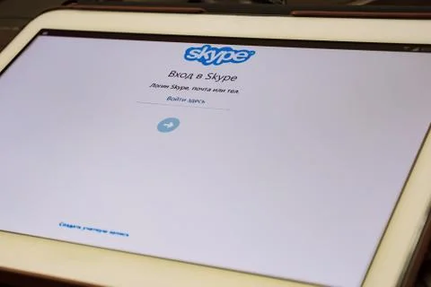 The start page of the free Skype application is open on the tablet screen Stock Photos