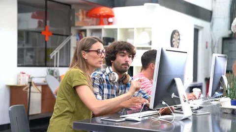 Start-up people working on desktop in co-working space Stock-Footage 77586949