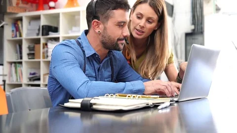 Start-up people working on laptop in office Stock Footage