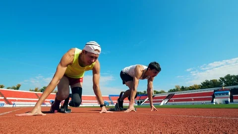 Start of a race between two paralympic runners Stock Footage 118614046