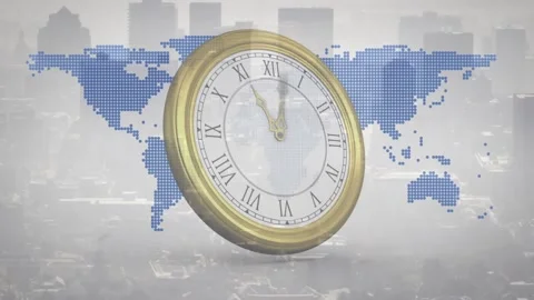 On start rotating brass-rimmed clock over dot map, hands advancing to show time Stock Footage 319800893