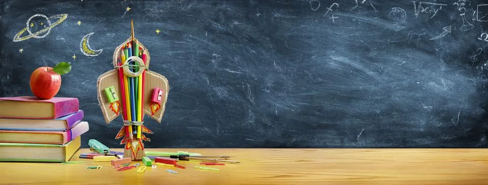Start School Concept - Rocket And Stationery On Desk With Drawn On Blackboard Stock Photos